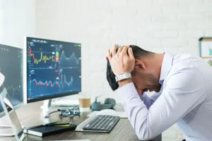 side-view-stressed-young-broker-sitting-6710d5fbcb32b